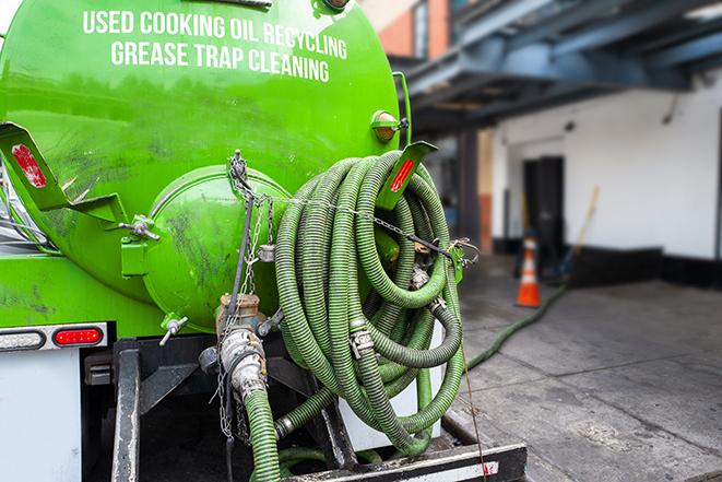 a vacuum truck pumping out a large underground grease trap in Cazenovia NY